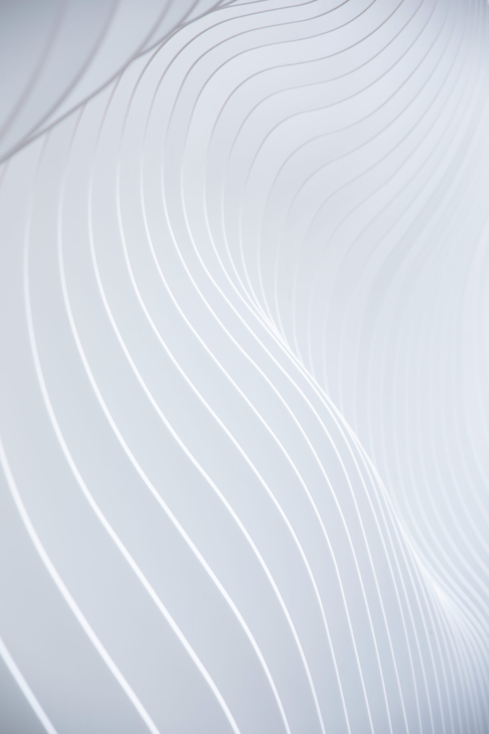 a close up of a white wall with wavy lines